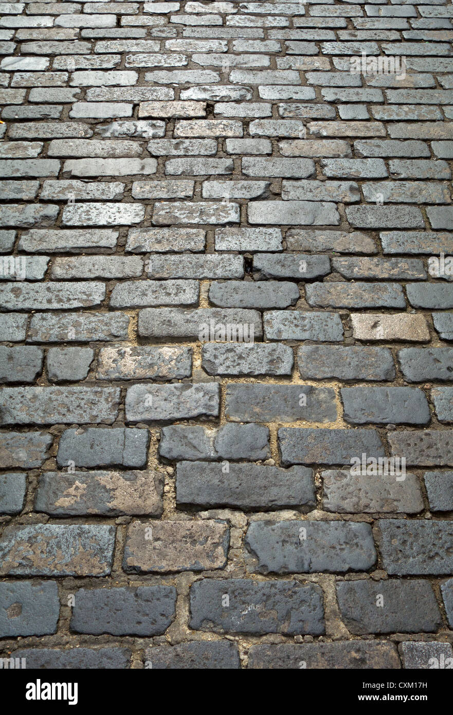 Old London cobblestone street cobbles close up. Stock Photo