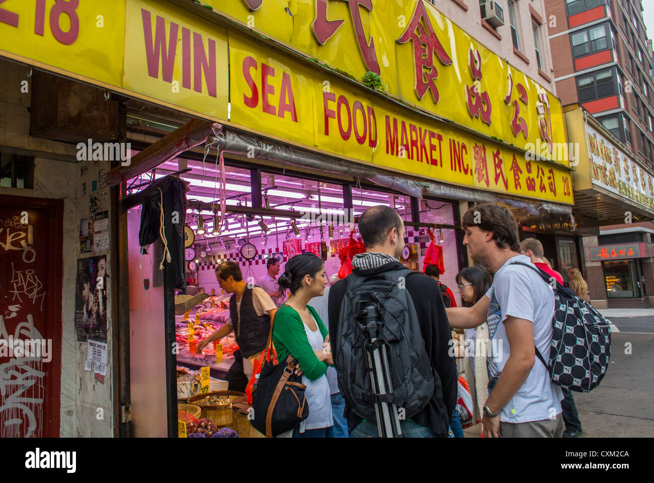 New York, NY, USA, Group Tourists on Sidewalk in Front of Chinese  Market, 'Win Sea Food market' on Street Scenes, Chinatown, multi ethnic store street Stock Photo