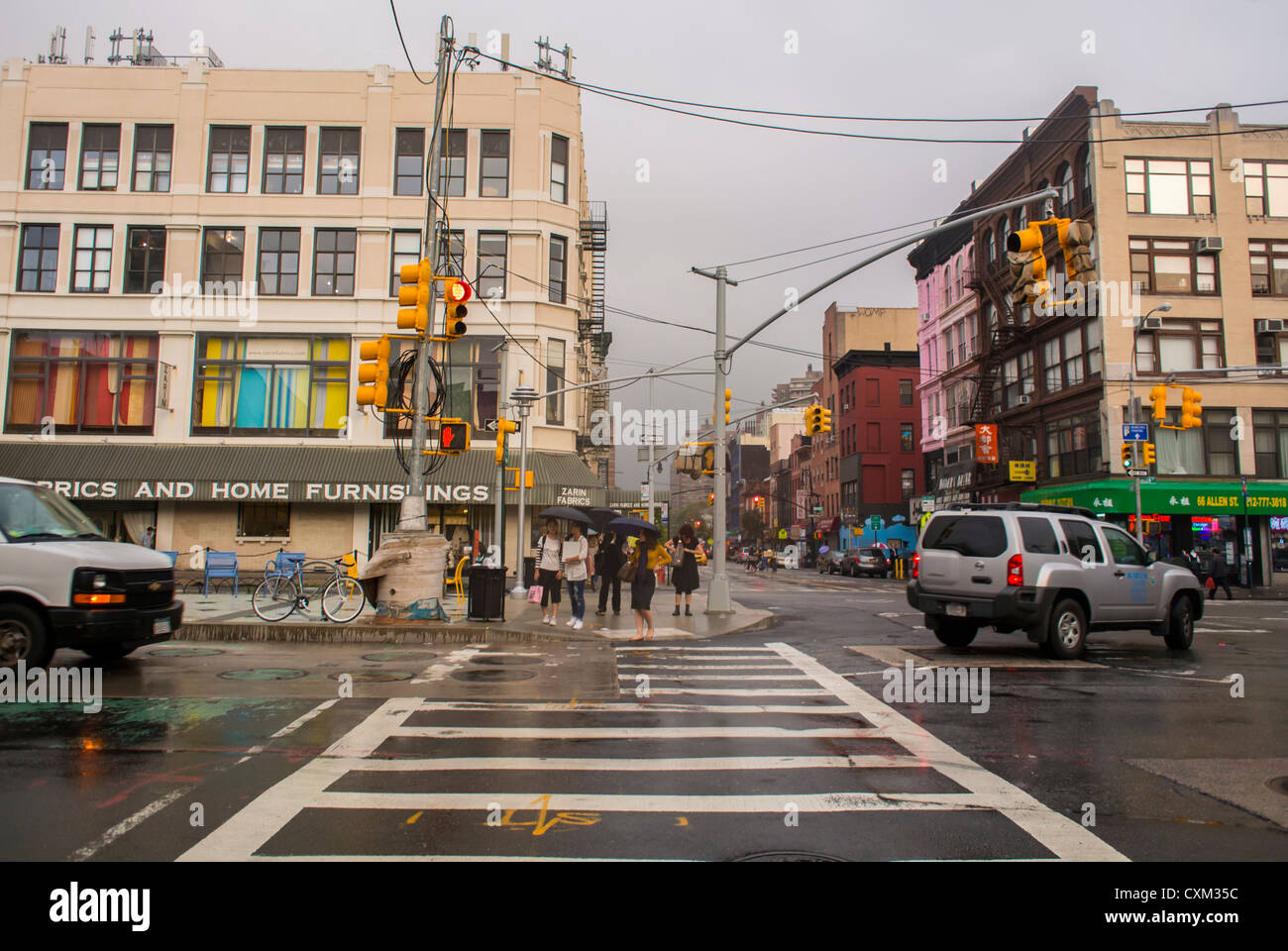 Cars roads driving crosswalks shop fronts road people tenements hires