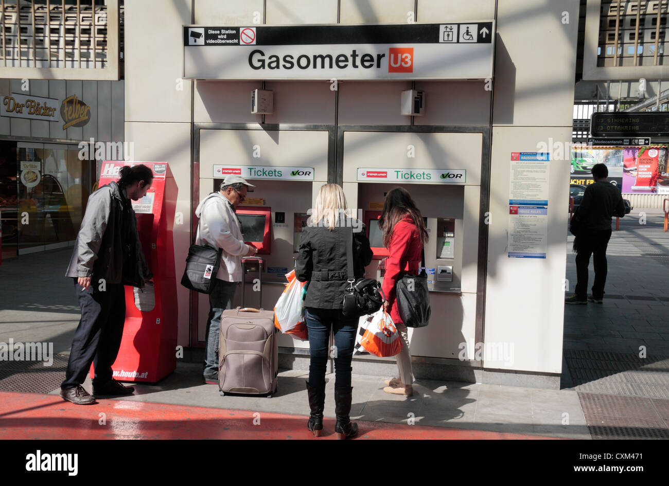 Passengers at a ticket machine outside the Gasometer U-bahn station, Vienna, (Wien), Austria. Stock Photo