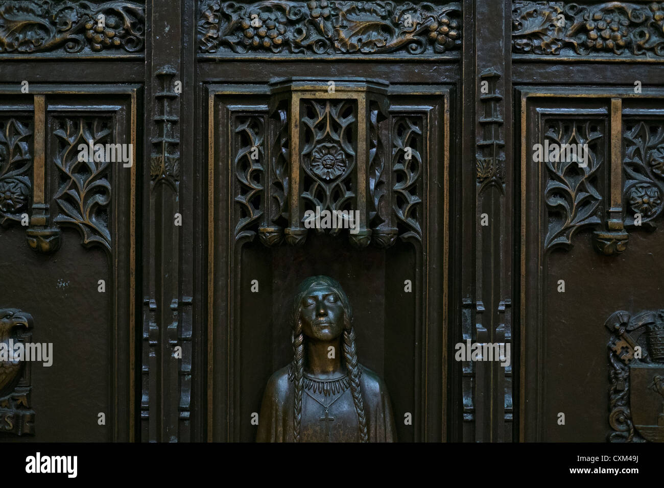 Figure of Kateri Tekakwitha on door to St. Patrick's Cathedral, New York, NY, US. Stock Photo