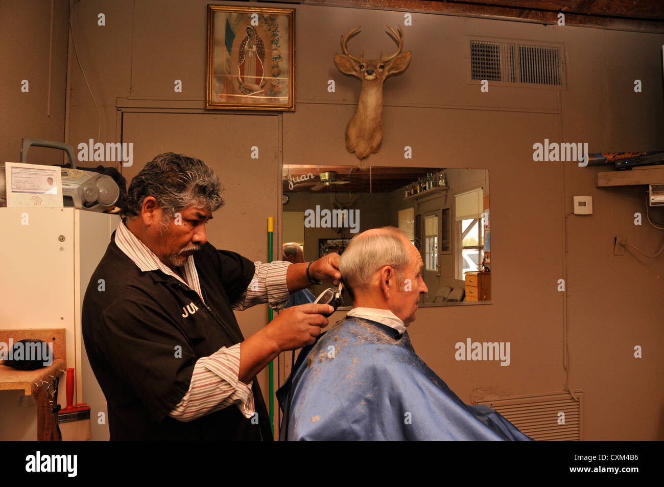 A man receives a haircut in Tucson, Arizona, USA Stock Photo Alamy