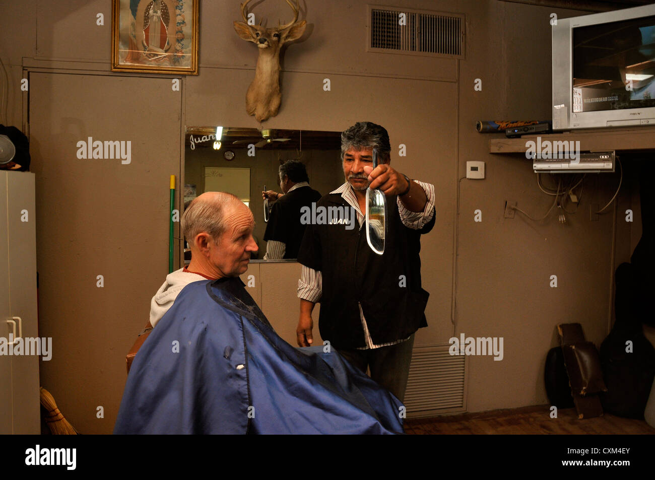 A man receives a haircut in Tucson, Arizona, USA Stock Photo Alamy