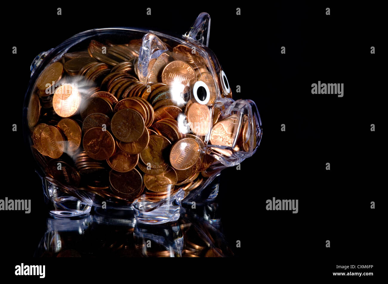 Clear plastic piggy bank full of American pennies Stock Photo Alamy