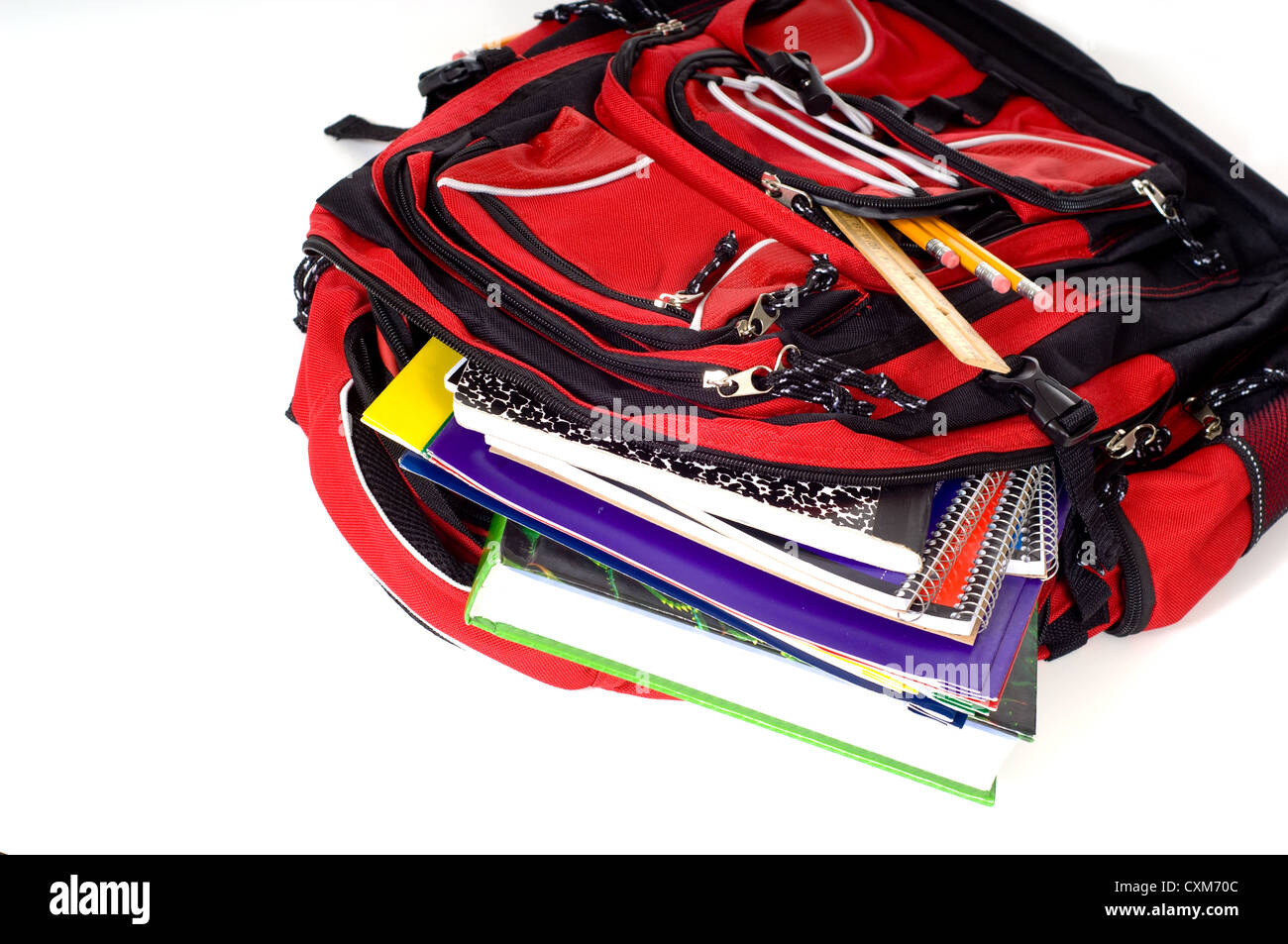 A red school backpack full of school supplies Stock Photo - Alamy