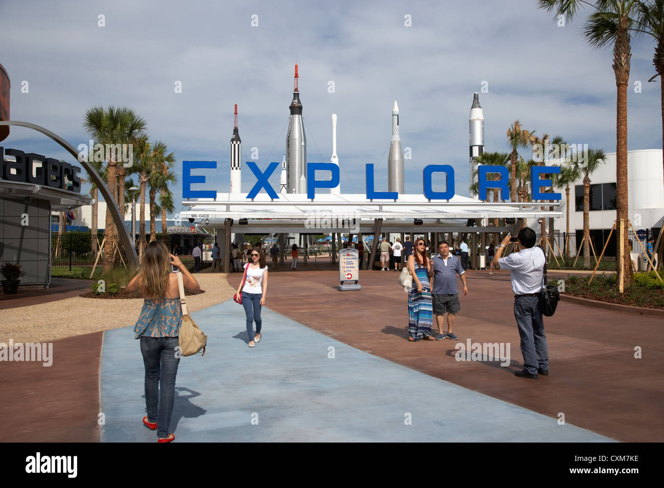 tourists pose for photos outside the entrance to the Kennedy Space Center Florida USA Stock Photo