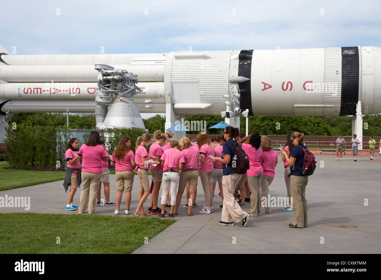 school group taking guided tour of the rocket garden at Kennedy Space Center Florida USA Stock Photo