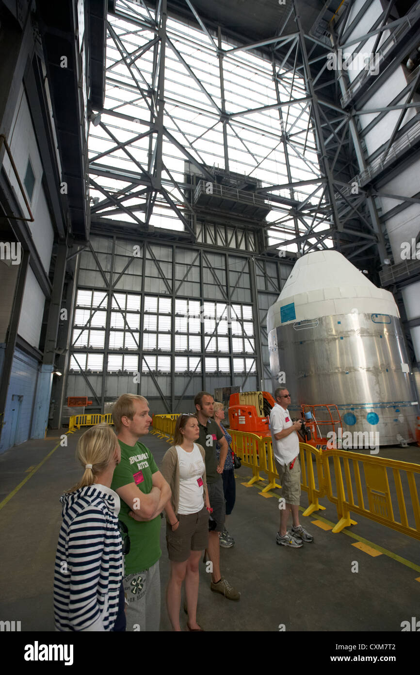 tourists on guided tour of the interior of the vehicle assembly building Kennedy Space Center Florida USA Stock Photo