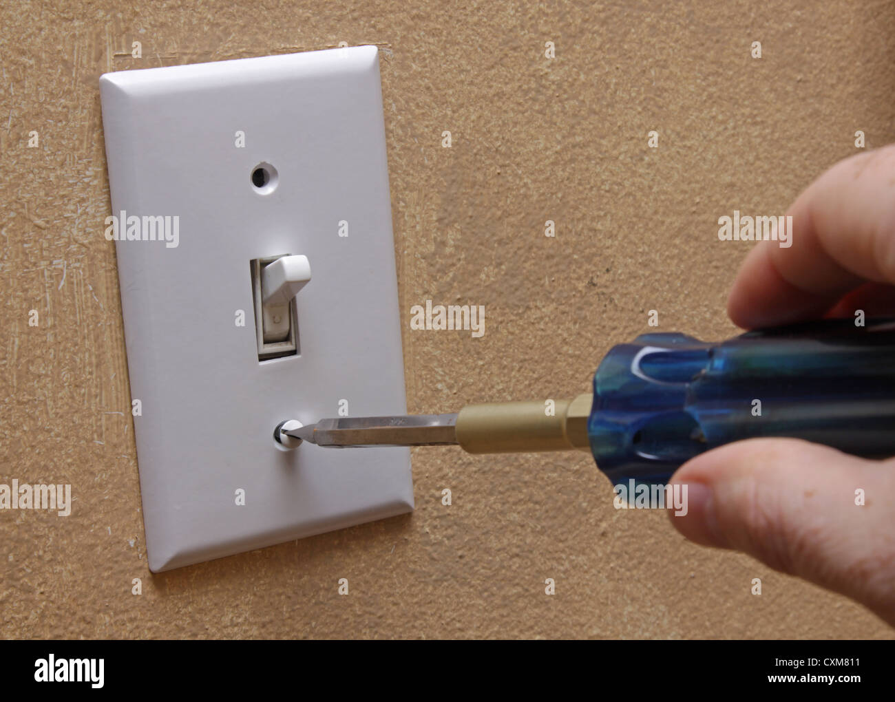 Installing Light Switch Cover Stock Photo