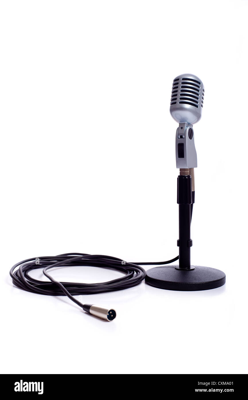 A vintage looking microphone on a white background with copy space Stock Photo