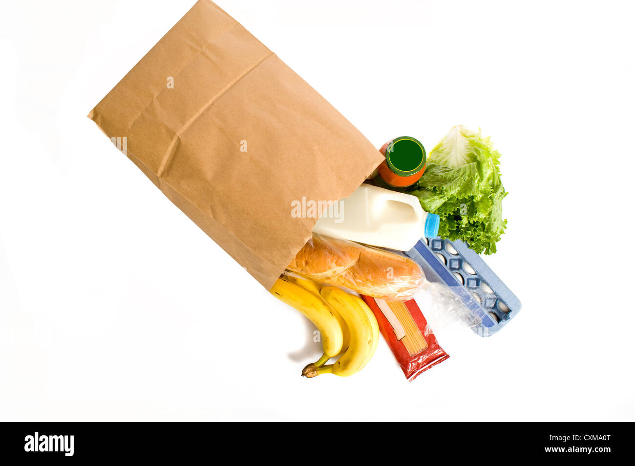 A brown paper bag full of groceries on a white background, with bread