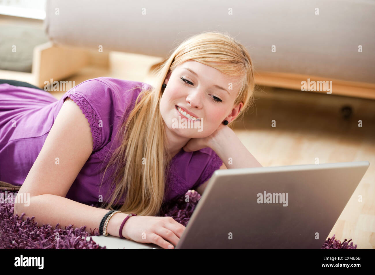 Young woman with laptop Stock Photo - Alamy