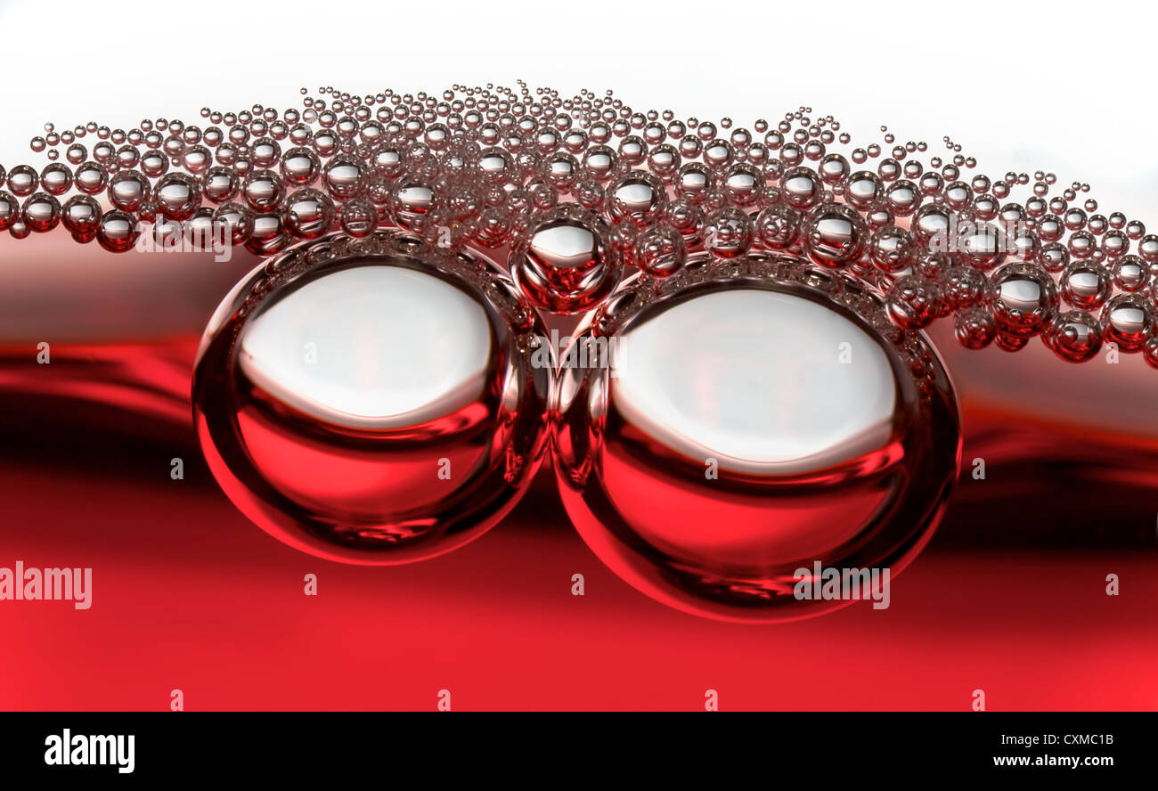 two large bubbles followed by smaller bubbles Stock Photo