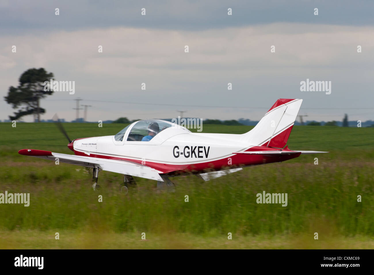 Pioneer 300 Hawk G-GKEV taxing along runway with flaps down Stock Photo