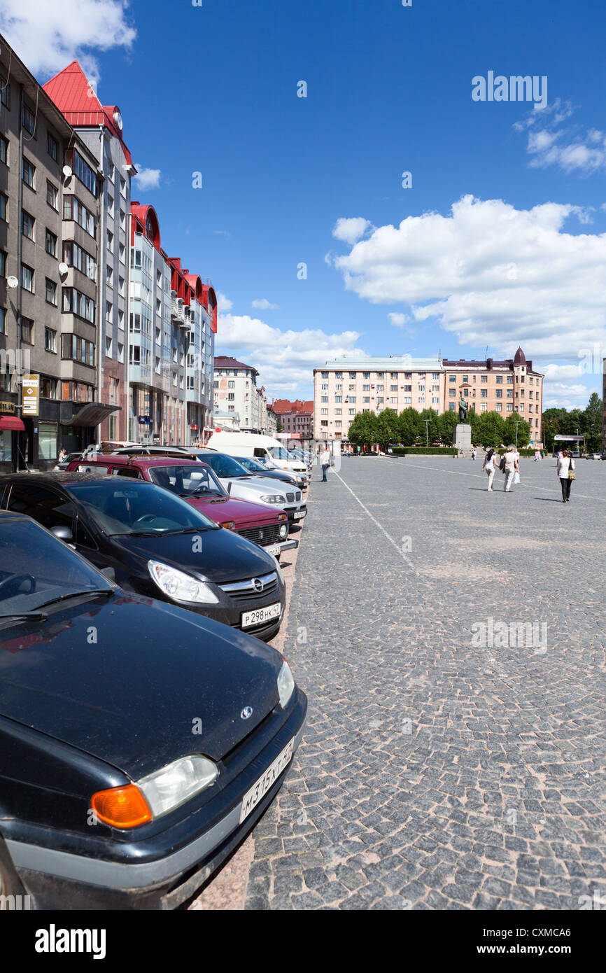Central square with parking cars in line and walking area, on circa June, 2012 in Vyborg, Russia Stock Photo