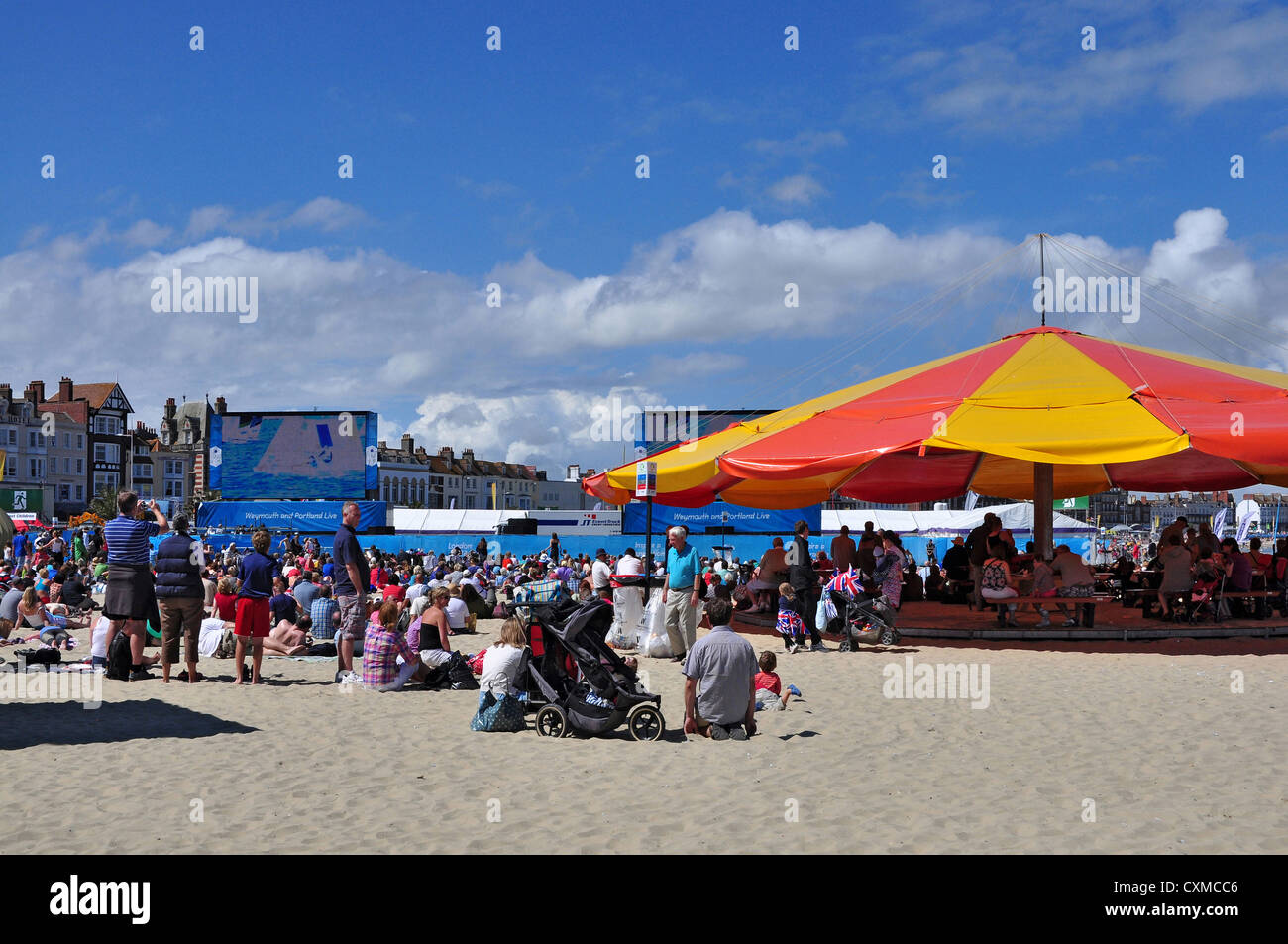 Weymouth beach, sailing competitions on big screens during the London 2012 Olympics. Stock Photo