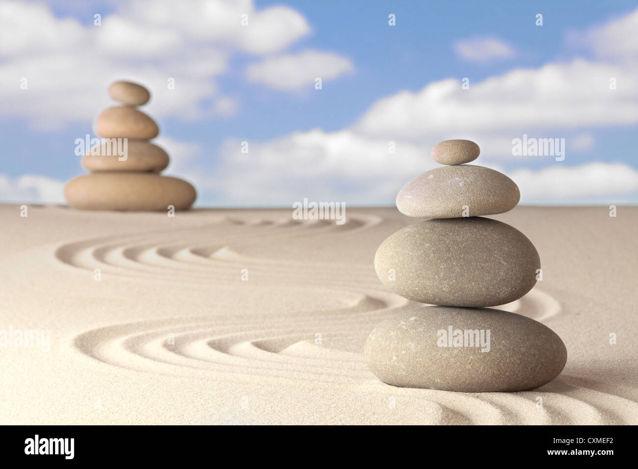 Spirituality and balance in a Japanese zen garden Sand and stone pattern concept for relaxation and concentration Stock Photo