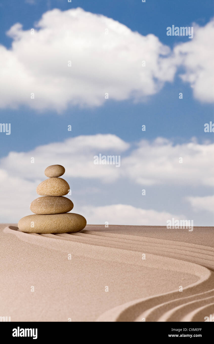 Balance and harmony spa relaxation or zen stone in Japanese zen garden pattern of rocks and sand simplicity and purity Stock Photo