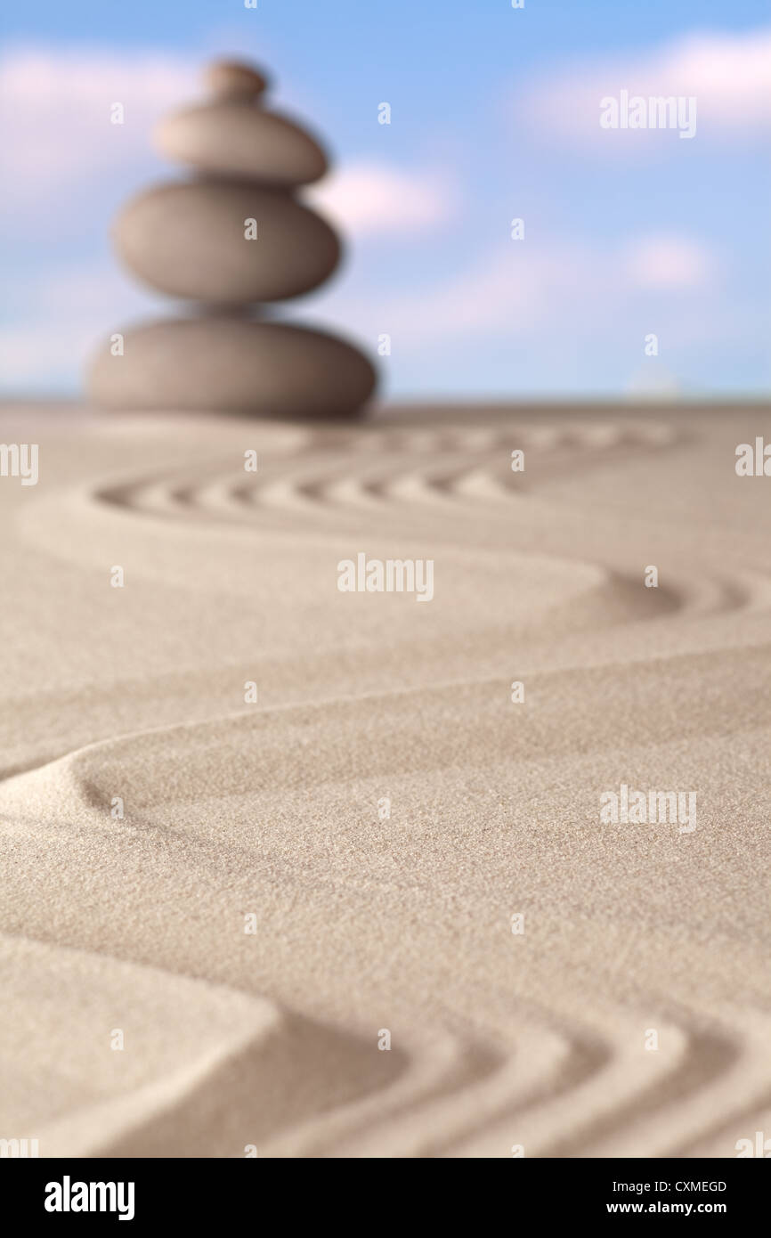 spirituality and purity in the harmony of a Japanese zen garden Pattern of sand and stones in balance Stock Photo