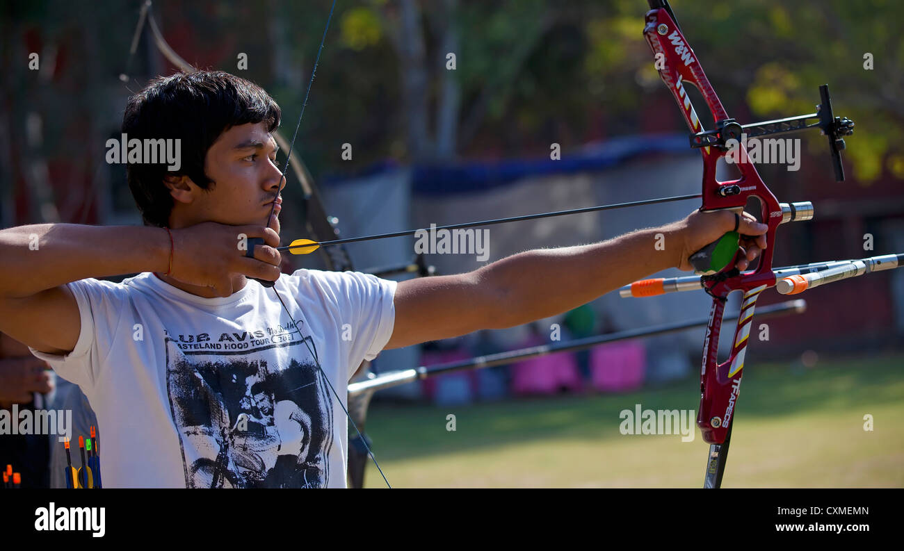Sportsperson practicing archery Stock Photo - Alamy