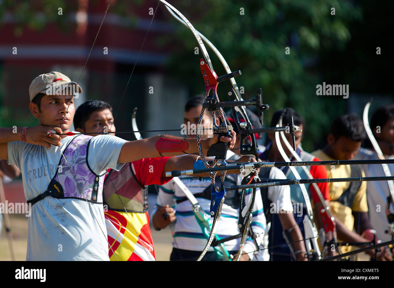 A group of Athlete compete in the national sport of archery Stock Photo