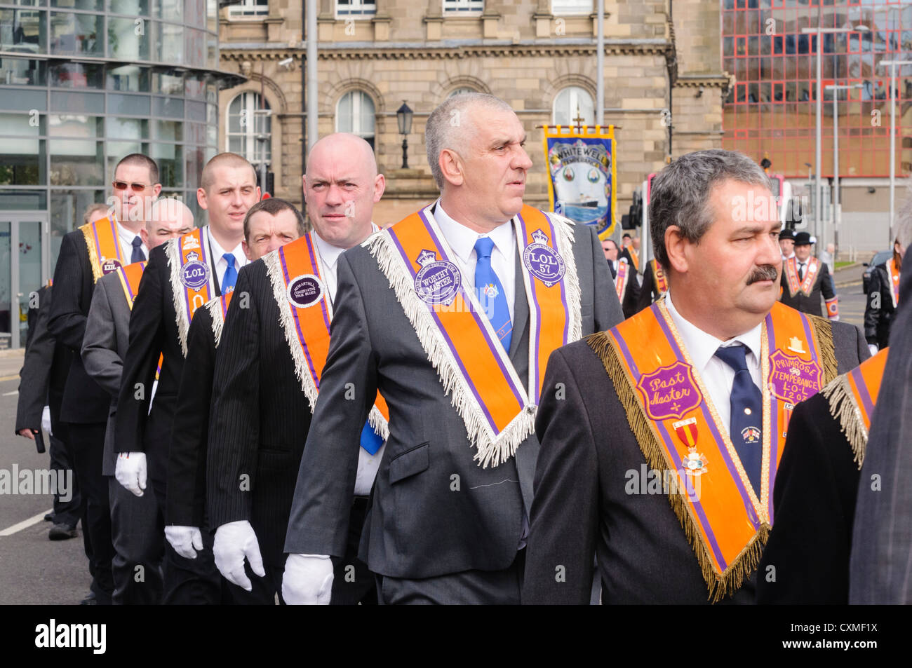 Number of orangemen wearing traditional 'Orange sash' as they march on