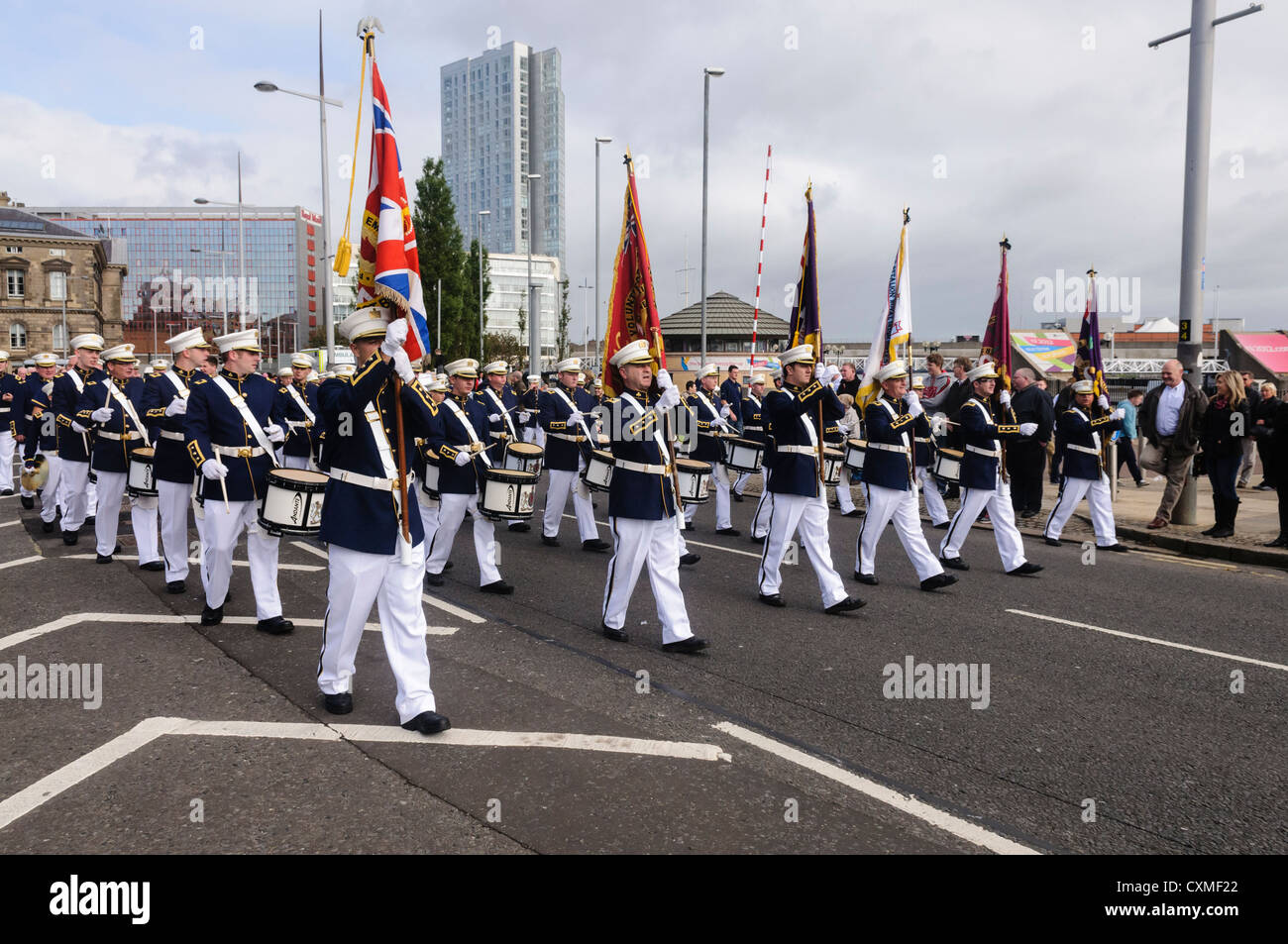 Flute band marches on a road in Belfast during an Orange Order parade Stock Photo