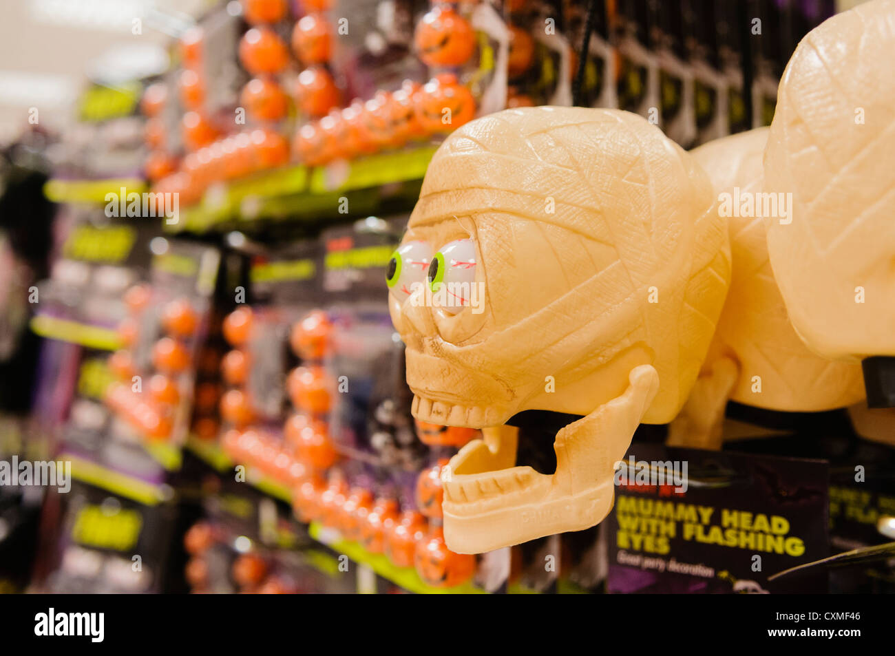 Seasonal Halloween goods on sale on the shelves in a Poundland shop store. Stock Photo