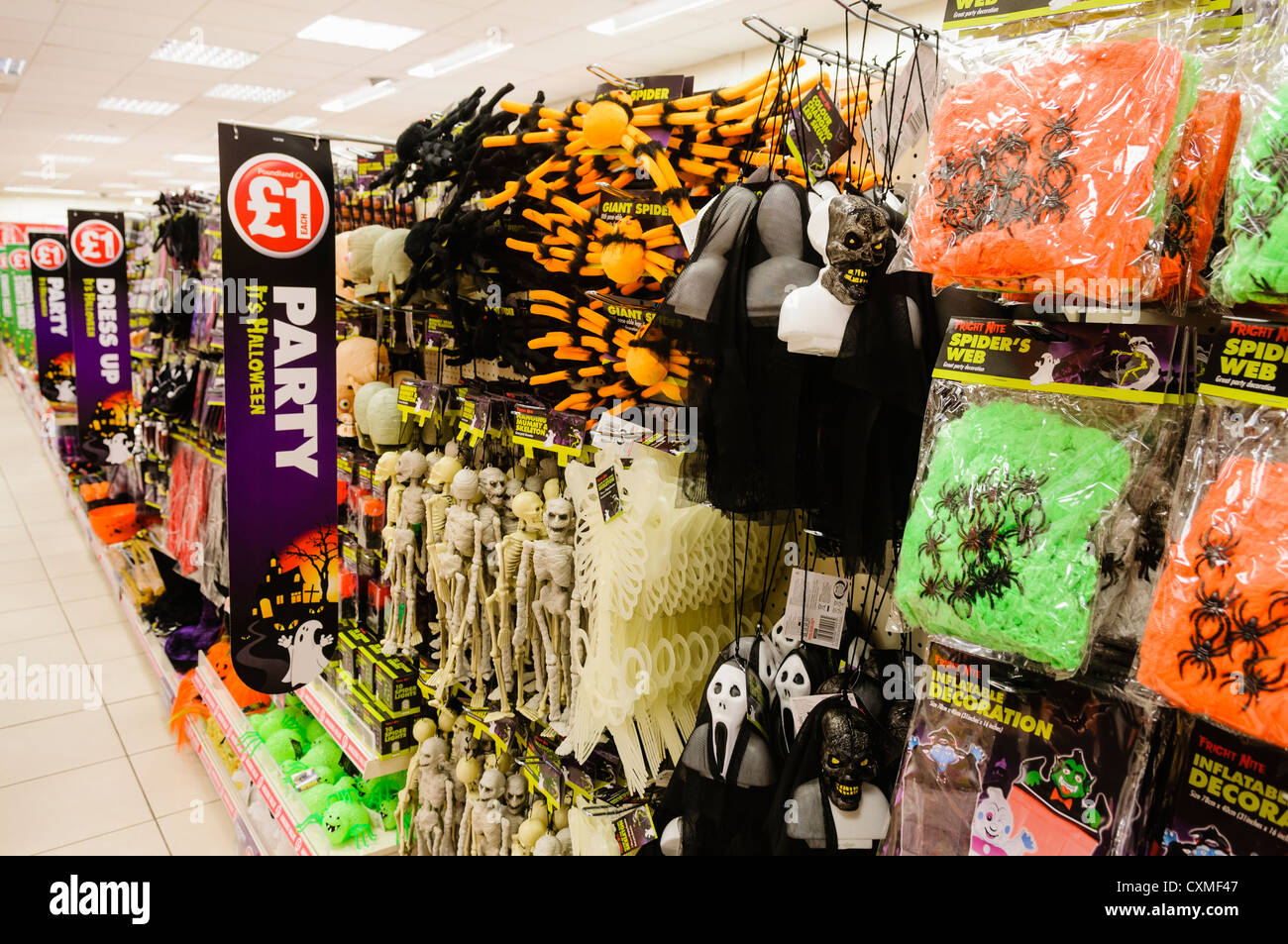 Seasonal Halloween goods on sale on the shelves in a Poundland shop store. Stock Photo