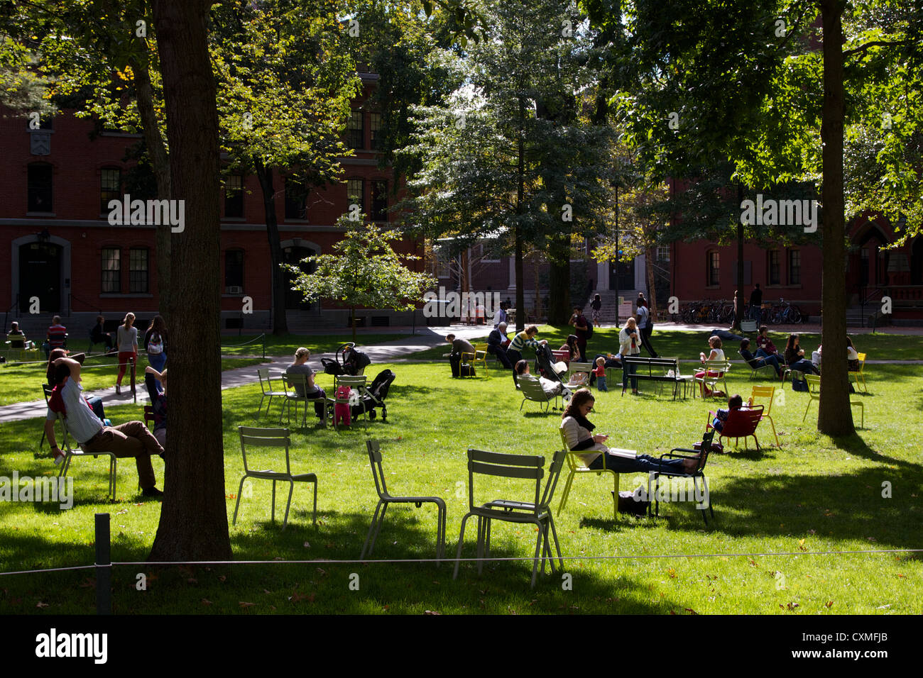 Tourists And Students Rest In Lawn Chairs On A Sunny Afternoon In