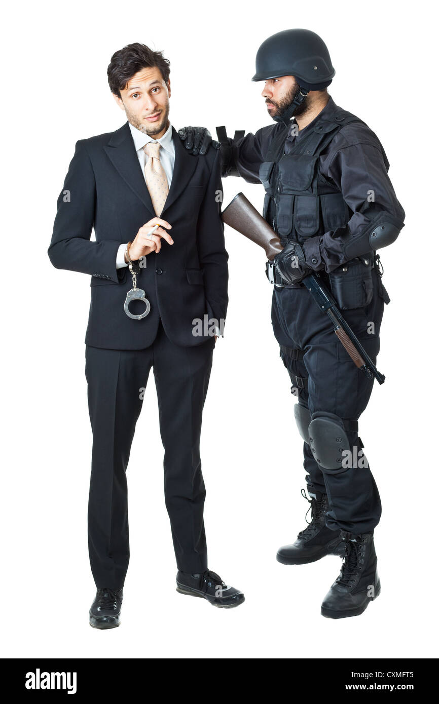 a corrupted businessman being arrested by a swat agent Stock Photo