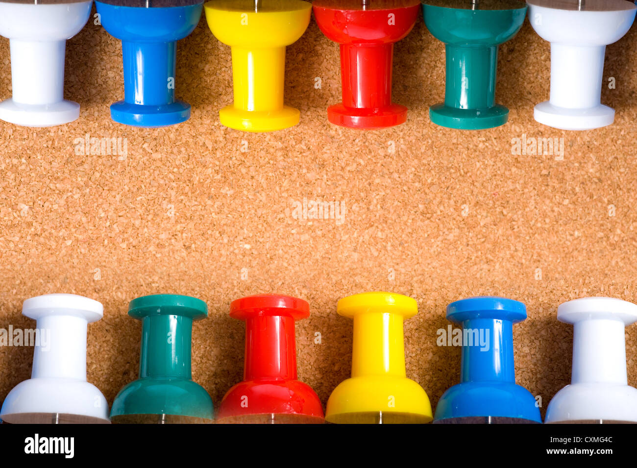 a bulletin board or cork board background with push pins and copy space