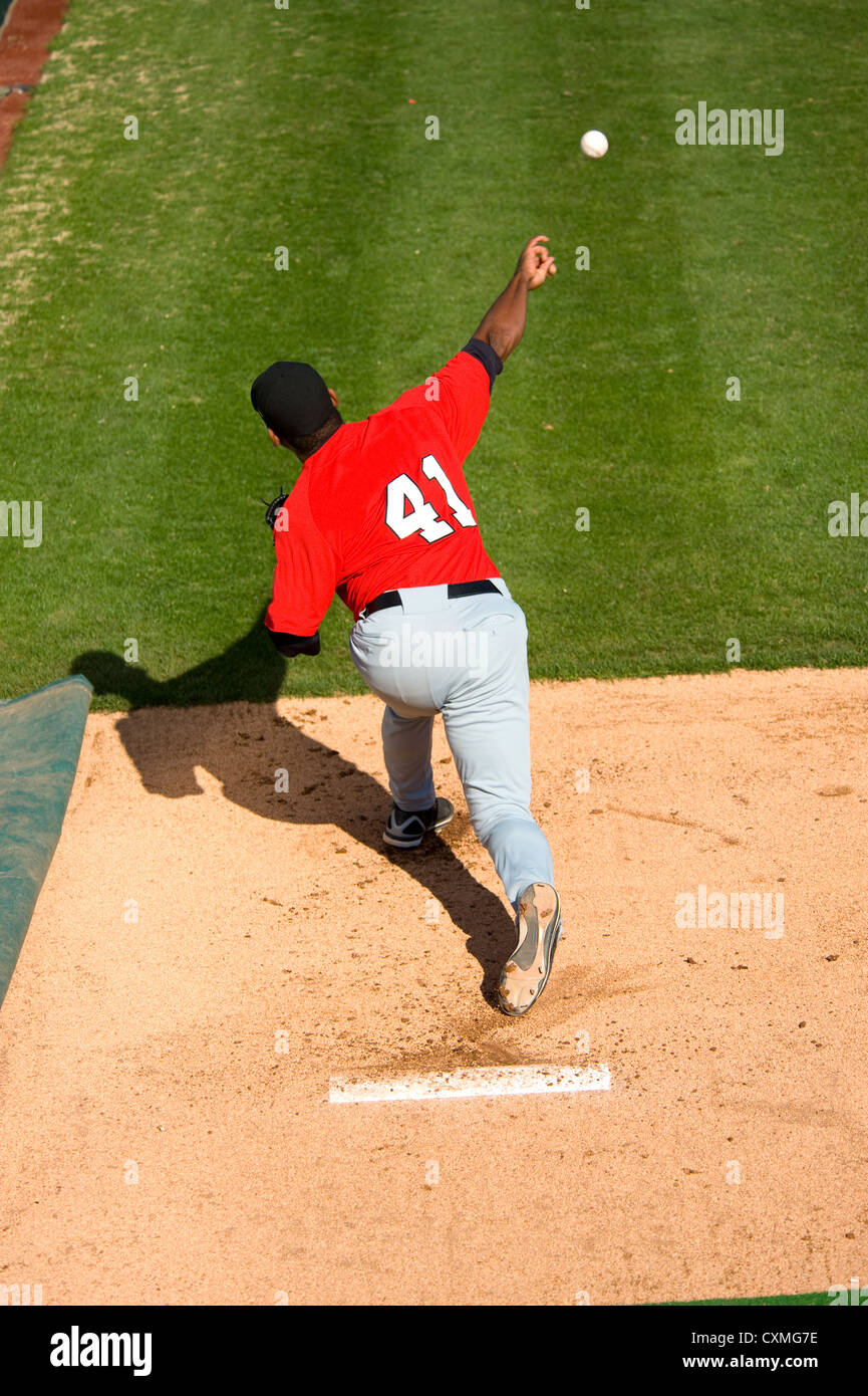a baseball pitcher throwing a pitch with copy space Stock Photo