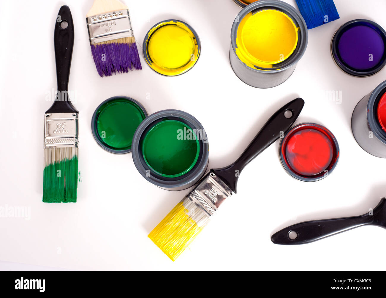 Colorful cans of paint on a white background forming a colorful