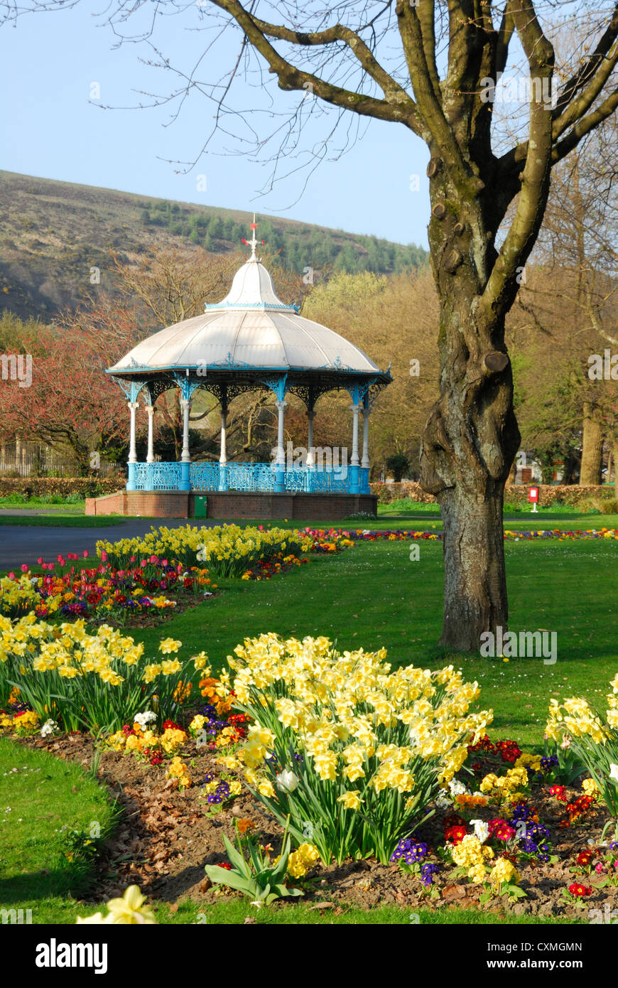 Bandstand in country park with flower borders and tree Stock Photo Alamy