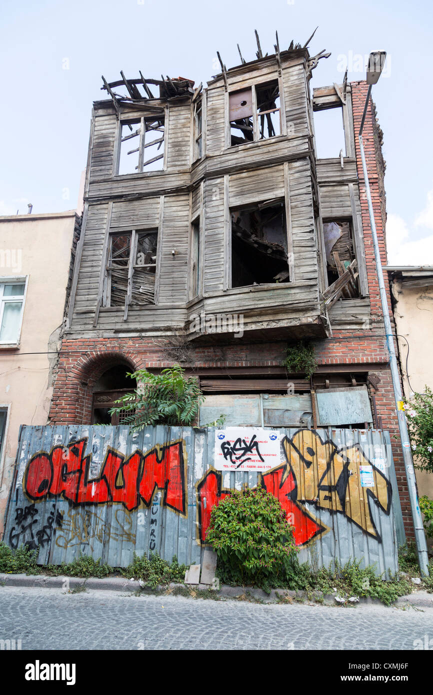 old house in Istanbul, Turkey, with graffiti on fence Stock Photo