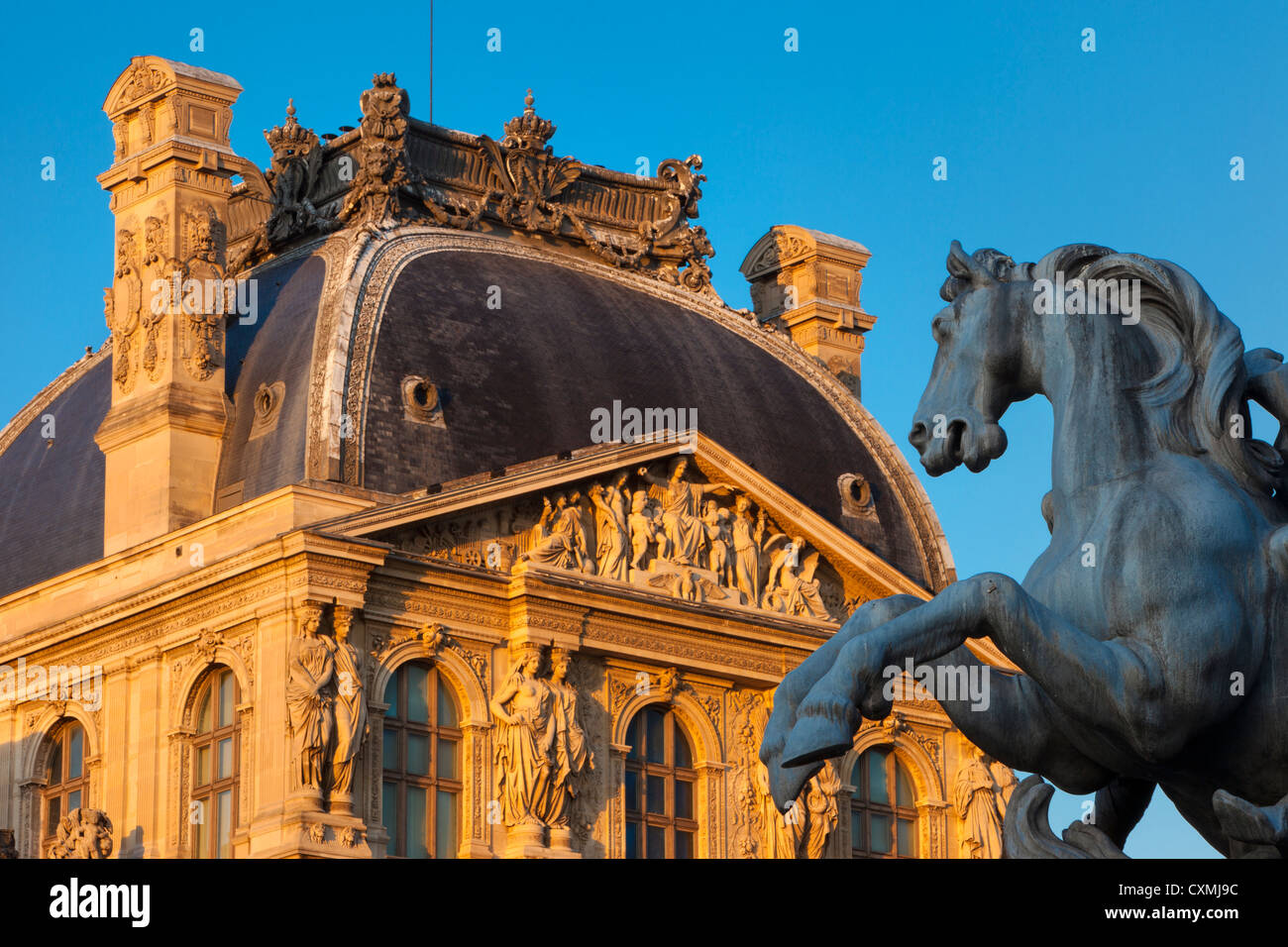 Equestrian statue of King Louis XIV at the entrance to Musee du Louvre, Paris France Stock Photo