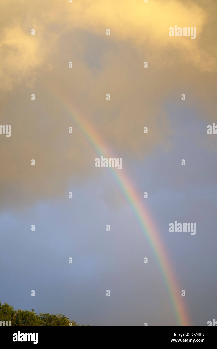 Rainbow and stormy sky Stock Photo - Alamy