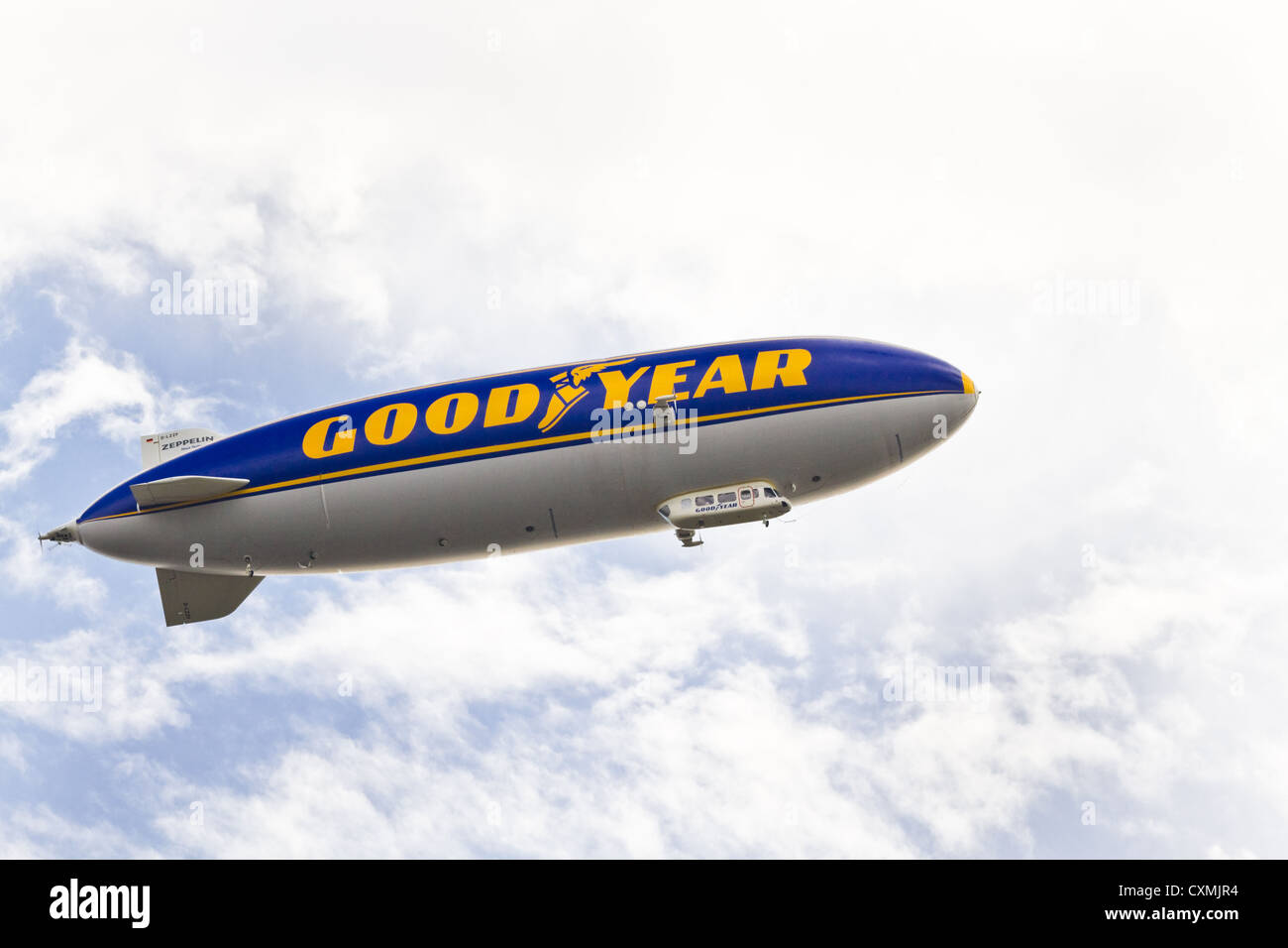 Big zeppeling in the sky with advertisement on it Stock Photo