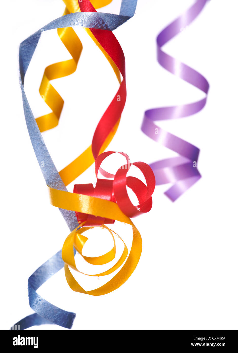 Colorful, curly, ribbon streamers on a white background with copy space