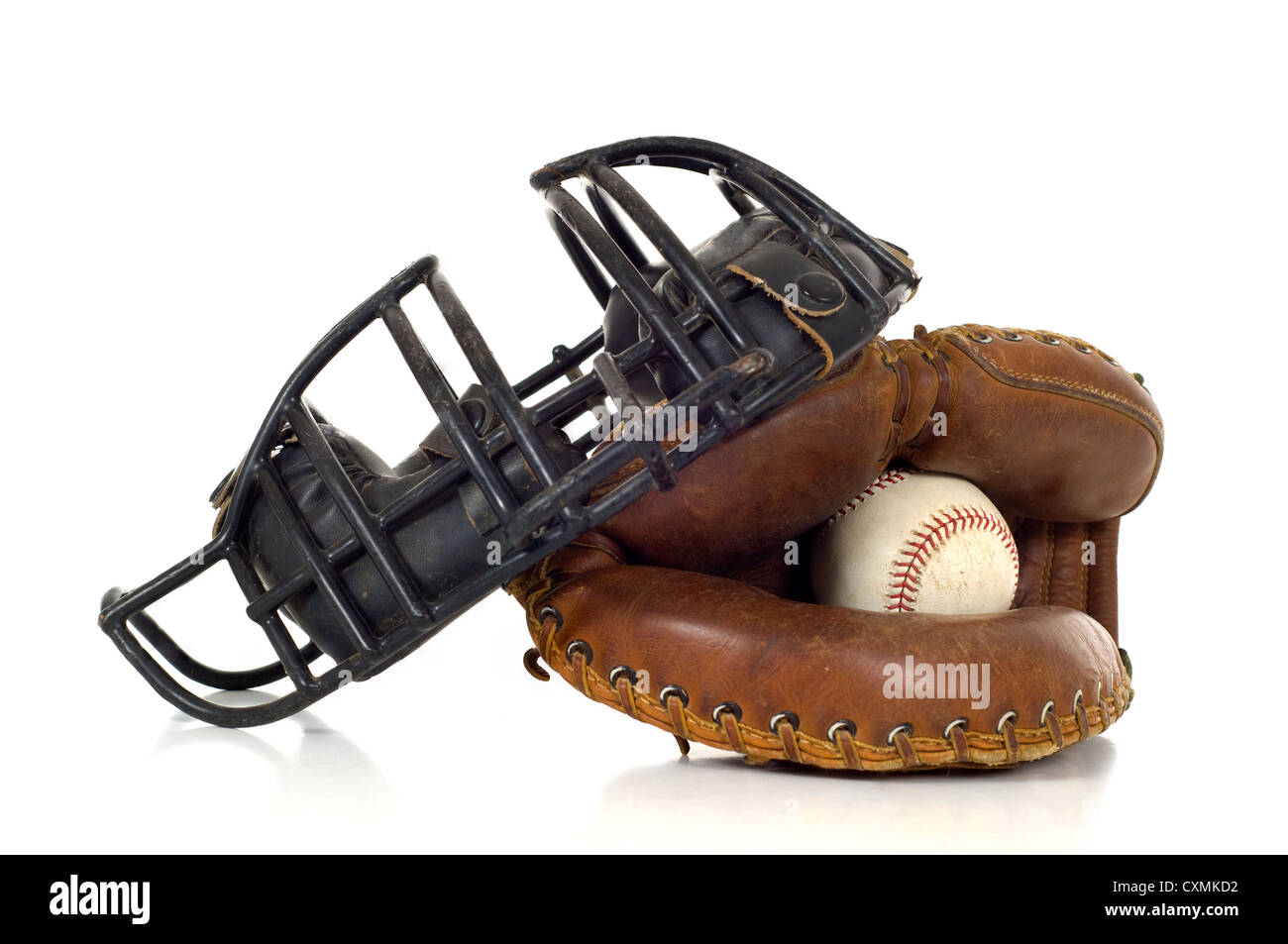 Baseball Catcher's gear on white background including a mitt, ball and face mask Stock Photo