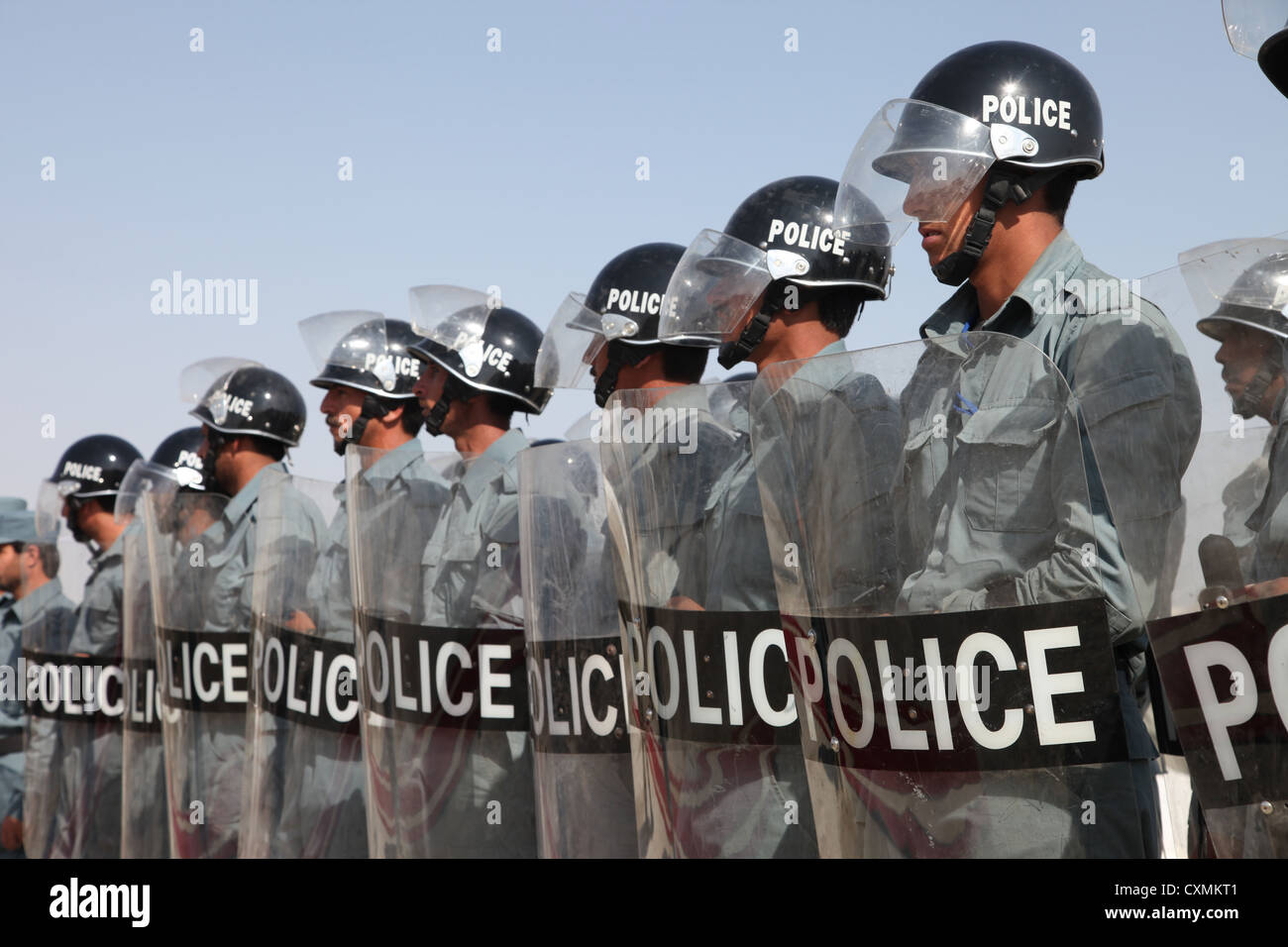 Afghan Uniform Police officers dressed in riot gear stand in formation before a tranche ceremony July 12, 2012 at the Miawon Compound, Forward Operating Base Shank, Logar province, Afghanistan. Stock Photo