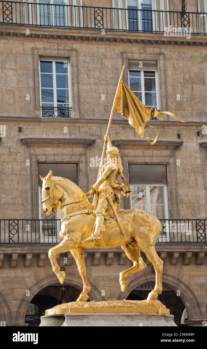Gold equestrian statue of Jeanne d'Arc (1874) by Emmanuel Frémiet (1824 – 1910) ; Place des Pyramides, cental Paris, France. Stock Photo