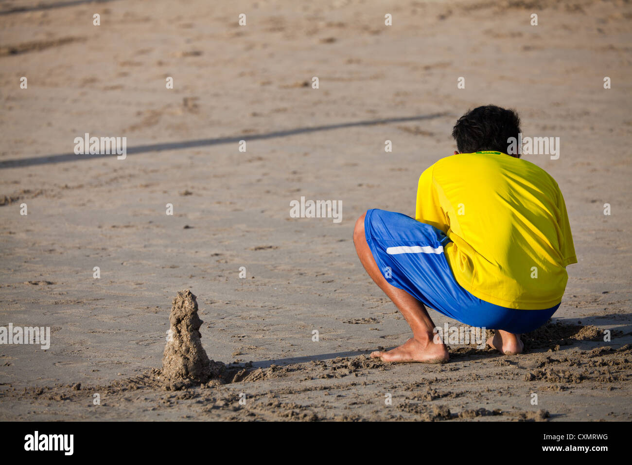 Child playing on Kuta Beach in Bali Stock Photo