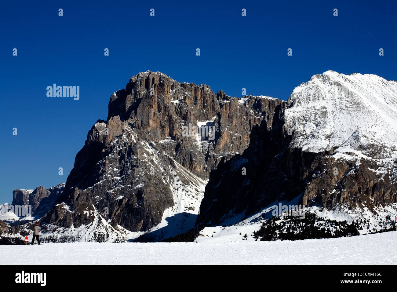 Sasso Piatto Plattkofel Sasplat snow field  and Sassolungo Langkofel   in backgoround Selva Val Gardena Dolomites Italy Stock Photo