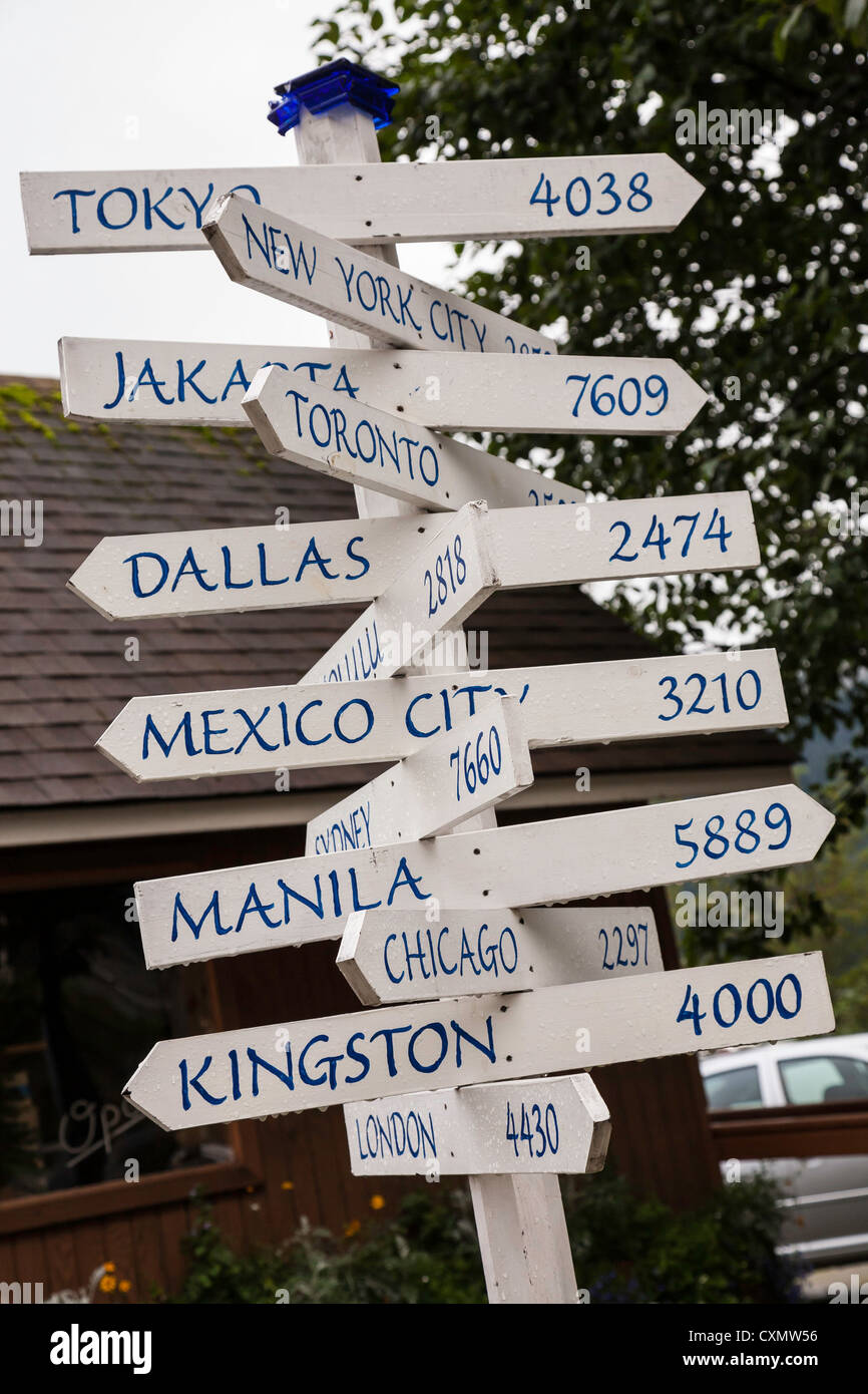 Signpost with Distances to Cities Around the World, Juneau, Alaska,, USA Stock Photo