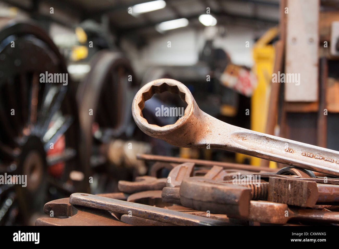 Ring spanner on workbench of tools used in engineering workshop