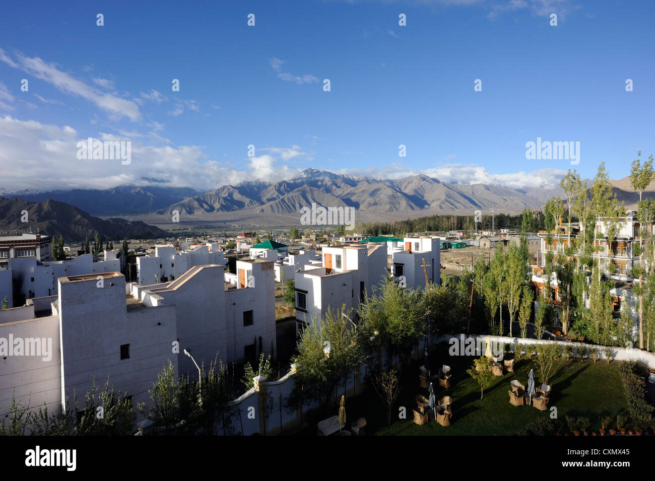 New buildings on the edge of Leh with the Zanscar mountains in the background. Leh, Ladakh, Republic on India. Stock Photo