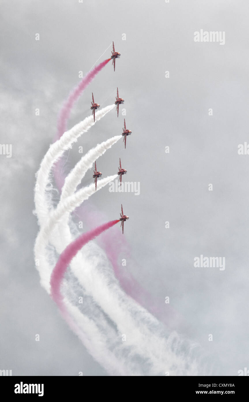 Another display of precision display flying from the British Red Arrows in their BAe Hawk Jet Trainers at the 2012 RIAT Stock Photo