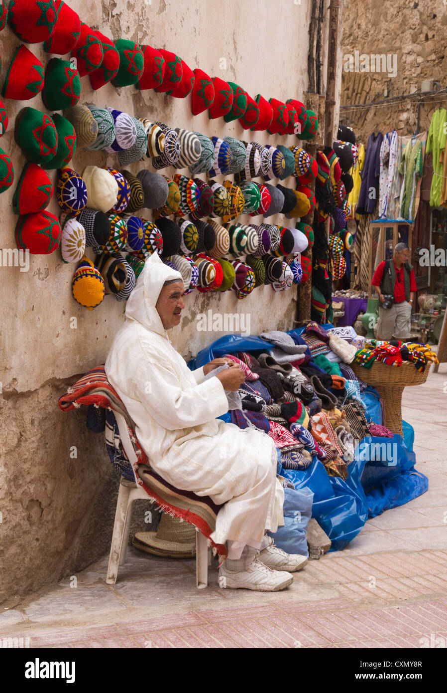 Crochet Man with handmade hats in the Medina Stock Photo